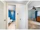 Hallway view of blue tiled bathroom and bedroom area at 1200 N Shore Ne Dr # 110, St Petersburg, FL 33701