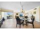 Bright living and dining area with sliding glass doors leading to a balcony at 1200 N Shore Ne Dr # 110, St Petersburg, FL 33701