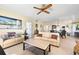 Spacious living room with tile floors, comfortable seating, and dining room views at 1200 N Shore Ne Dr # 110, St Petersburg, FL 33701
