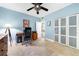 Bright home office with a closet, a desk, and tan tiled floors at 1200 N Shore Ne Dr # 110, St Petersburg, FL 33701