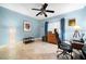 Bright office space with tan tiled floors, a desk, and a ceiling fan at 1200 N Shore Ne Dr # 110, St Petersburg, FL 33701