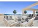 Outdoor patio furnished with wicker chairs and a ocean view at 1200 N Shore Ne Dr # 110, St Petersburg, FL 33701