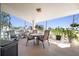 Relaxing outdoor patio seating area with views of the water and tropical surroundings at 1200 N Shore Ne Dr # 110, St Petersburg, FL 33701