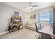 Neutral bedroom featuring a daybed and decorative shelving with view through window at 12033 Gandy N Blvd # 175, St Petersburg, FL 33702