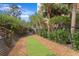A fenced dog run area with mulch and artificial turf for pets to enjoy at 12033 Gandy N Blvd # 175, St Petersburg, FL 33702