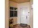 Inviting condo front entrance with decorative pot, patterned rug, and secure doorway at 12033 Gandy N Blvd # 175, St Petersburg, FL 33702