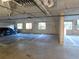 A well-lit, clean underground parking garage with marked spaces at 12033 Gandy N Blvd # 175, St Petersburg, FL 33702