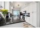 Modern kitchen featuring granite countertops, white cabinets, and stainless steel appliances at 12033 Gandy N Blvd # 175, St Petersburg, FL 33702
