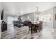 Open-concept living space features hardwood floors, large windows, and comfortable seating area at 12033 Gandy N Blvd # 175, St Petersburg, FL 33702