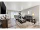 Spacious living room featuring an open floor plan, wood floors, and sliding glass doors to a balcony at 12033 Gandy N Blvd # 175, St Petersburg, FL 33702