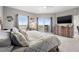 Serene bedroom with a large bed and balcony access, offering beautiful outdoor views and a peaceful retreat at 12033 Gandy N Blvd # 175, St Petersburg, FL 33702