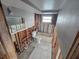 Unfinished bathroom featuring a toilet, bathtub and a window ready for renovations at 12734 2Nd Isle, Hudson, FL 34667