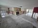 Spacious living room featuring an stone fireplace and large windows ready for renovations at 12734 2Nd Isle, Hudson, FL 34667