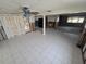 Spacious living room with tile floors, ceiling fan and large windows offer ample natural light at 12734 2Nd Isle, Hudson, FL 34667