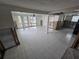 Spacious living room with tile floors, ceiling fan and large windows offer ample natural light at 12734 2Nd Isle, Hudson, FL 34667