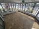 Bright sun room with panoramic views through multiple windows and a ceiling fan at 12734 2Nd Isle, Hudson, FL 34667