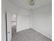 Bedroom boasts wood-look tile and a double door closet at 14300 Kay Ln, Port Charlotte, FL 33981
