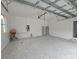 Spacious two-car garage with concrete floors at 14300 Kay Ln, Port Charlotte, FL 33981