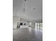 Open concept kitchen, dining and living space with gray flooring at 14300 Kay Ln, Port Charlotte, FL 33981