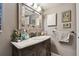 Bathroom vanity with a decorative mirror and ample counter space at 1508 Cascade Ct, Dunedin, FL 34698