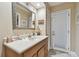 Bathroom with a vanity with sink, a door with blinds, and a large mirror at 1508 Cascade Ct, Dunedin, FL 34698