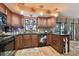 Stylish kitchen with granite countertops, wood cabinets, and unique design at 1508 Cascade Ct, Dunedin, FL 34698