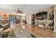 Open-concept living and dining area with wood floors and comfortable furniture at 1508 Cascade Ct, Dunedin, FL 34698
