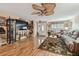 Inviting living room with wood flooring, ceiling fan, and stylish decor at 1508 Cascade Ct, Dunedin, FL 34698