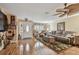 Comfortable living room featuring wood floors, large window, and warm interior paint at 1508 Cascade Ct, Dunedin, FL 34698