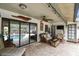 This covered outdoor living space has sliding glass doors that let you enjoy the pool at 1508 Cascade Ct, Dunedin, FL 34698