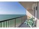 Balcony view with two green Adirondack chairs overlooking the beautiful ocean at 1600 Gulf Blvd # 1111, Clearwater, FL 33767