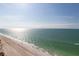 Beach view from building overlooking sandy shore and turquoise waters at 1600 Gulf Blvd # 1111, Clearwater, FL 33767