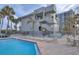 Relaxing community pool with plenty of lounging chairs and tables for entertaining at 1600 Gulf Blvd # 1111, Clearwater Beach, FL 33767