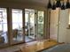Bedroom with French doors opening to a peaceful screened porch for outdoor enjoyment at 16921 Crawley Rd, Odessa, FL 33556