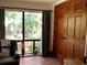 Inviting bedroom featuring tile flooring, natural light and outdoor views at 16921 Crawley Rd, Odessa, FL 33556