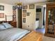 Bedroom with chandelier, dresser, and ensuite bathroom, creating a cozy retreat at 16921 Crawley Rd, Odessa, FL 33556
