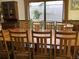 Cozy dining room with a long wooden table and comfortable seating arrangement at 16921 Crawley Rd, Odessa, FL 33556