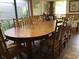Spacious dining room featuring a large wooden table perfect for gatherings at 16921 Crawley Rd, Odessa, FL 33556