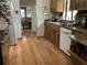 Well-maintained kitchen with laminate floors, granite counters, and appliances at 16921 Crawley Rd, Odessa, FL 33556