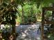 Private deck with plants, wooden accents, and views to a verdant yard at 16921 Crawley Rd, Odessa, FL 33556