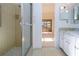 Bathroom with a stand up shower, tiled wall and floor, and a light green countertop at 1742 W Del Webb Blvd, Sun City Center, FL 33573