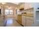 Efficient kitchen featuring white cabinets and laminate countertops at 1742 W Del Webb Blvd, Sun City Center, FL 33573