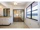 Cozy kitchenette with linoleum floor and view into sunroom and backyard at 1742 W Del Webb Blvd, Sun City Center, FL 33573