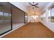 Enclosed lanai featuring tiled floor, ceiling fans, and multiple windows at 1742 W Del Webb Blvd, Sun City Center, FL 33573