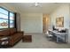 Spacious living room with seating, work area and large window view of the landscape at 1742 W Del Webb Blvd, Sun City Center, FL 33573