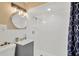 Modern bathroom featuring sleek vanity, updated shower, and stylish fixtures at 1910 E Chelsea St, Tampa, FL 33610
