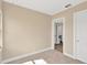Bedroom features carpet, a large window, and an en suite bathroom at 1910 E Chelsea St, Tampa, FL 33610