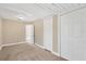 Bright bedroom featuring neutral walls, carpet floors, and a large closet at 1910 E Chelsea St, Tampa, FL 33610