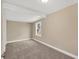 Cozy bedroom with neutral walls, carpet floors, and a window for natural light at 1910 E Chelsea St, Tampa, FL 33610