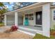 Charming front porch with modern accents, brickwork and decorative concrete at 1910 E Chelsea St, Tampa, FL 33610